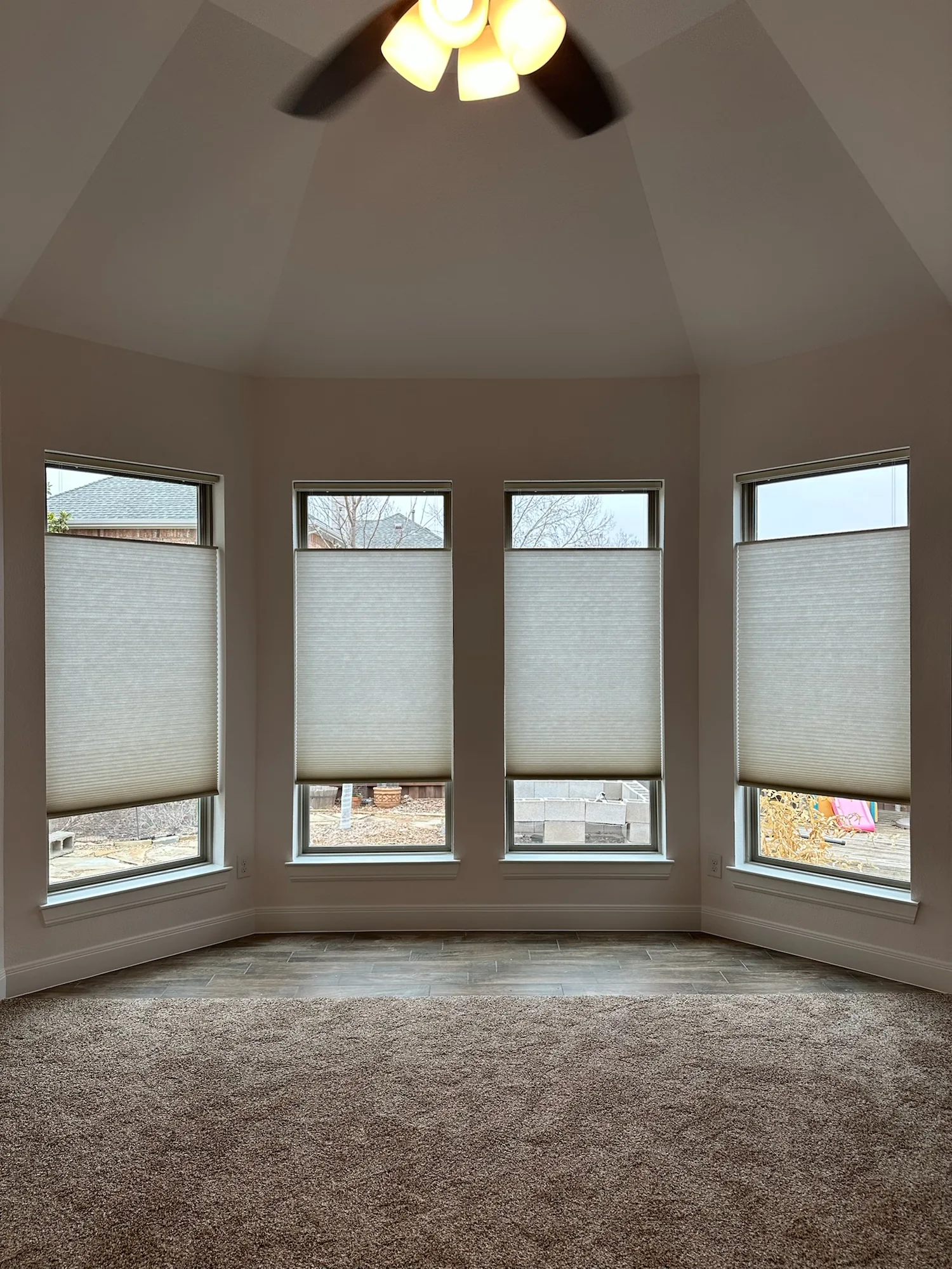 Cellular honeycomb shades inside a deep-set window well in Tanque Verde, Tucson