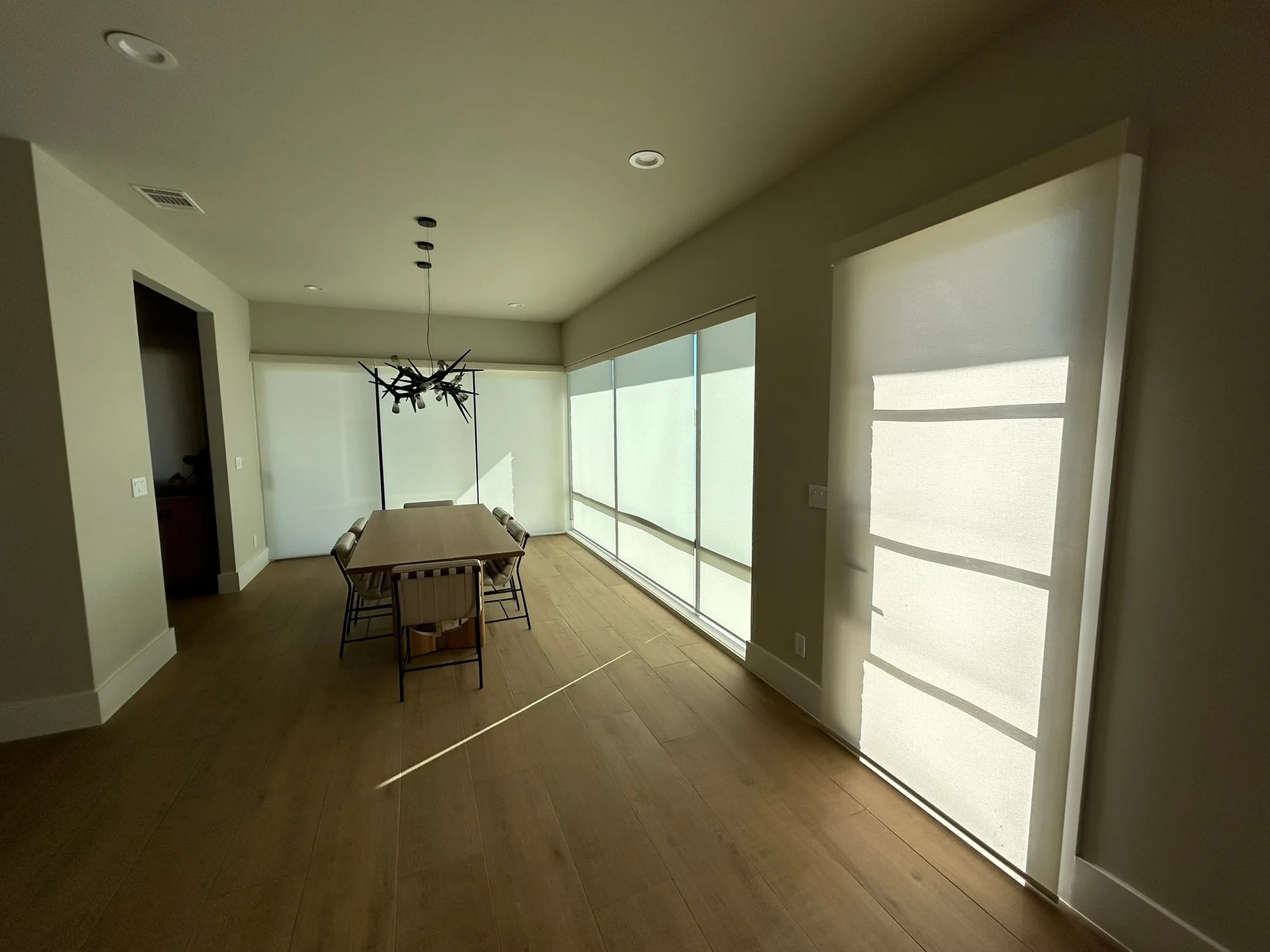 Wall of light-filtering energy efficient shades installed by Love Is Blinds